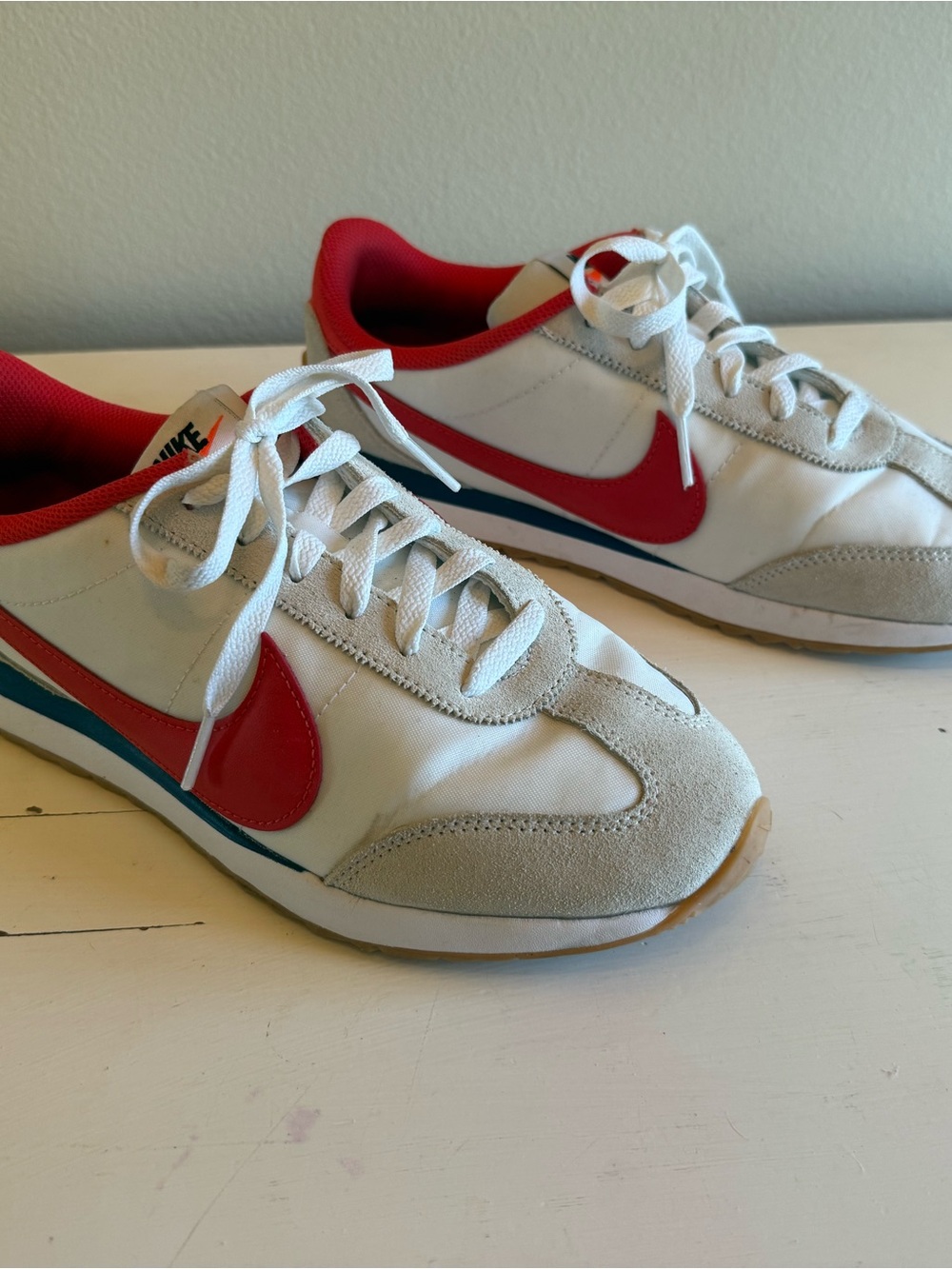 Nike White Sneakers with Red Swoosh and Teal Stripe